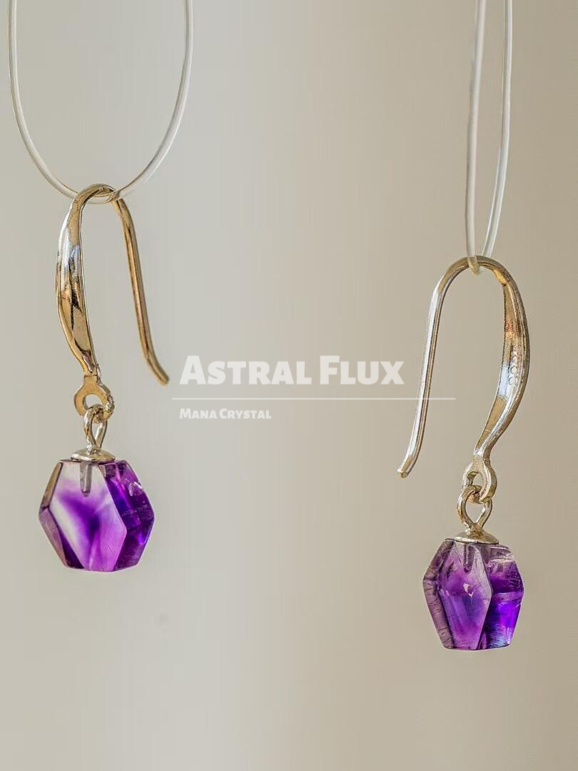 Purple crystal earrings with cosmic blessings in the ears